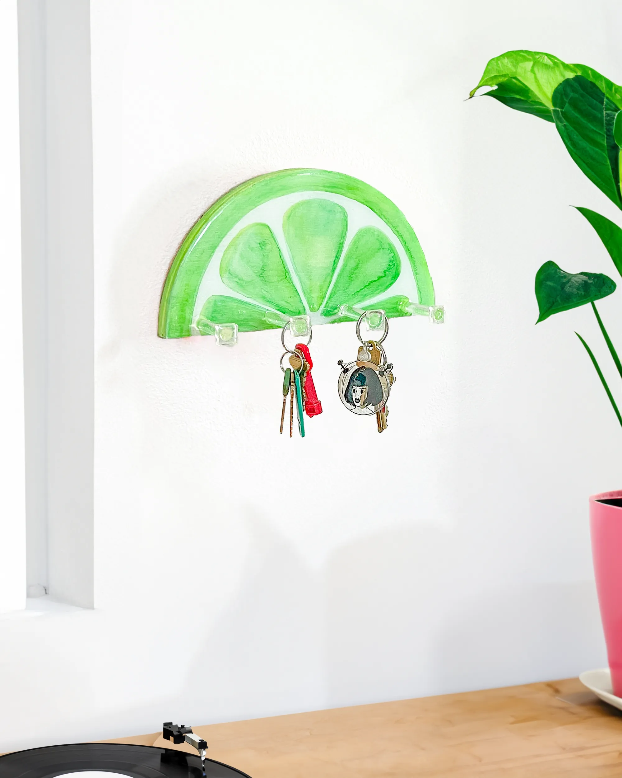 Artistic and practical lime slice key holder, featuring four durable clear hooks for organizing keys and accessories