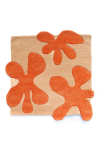 A sculpted 3D flower rug designed to bring organic texture to modern spaces