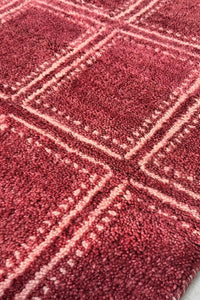 Modern red geometric area rug with clean box patterns, hand-knotted from wool