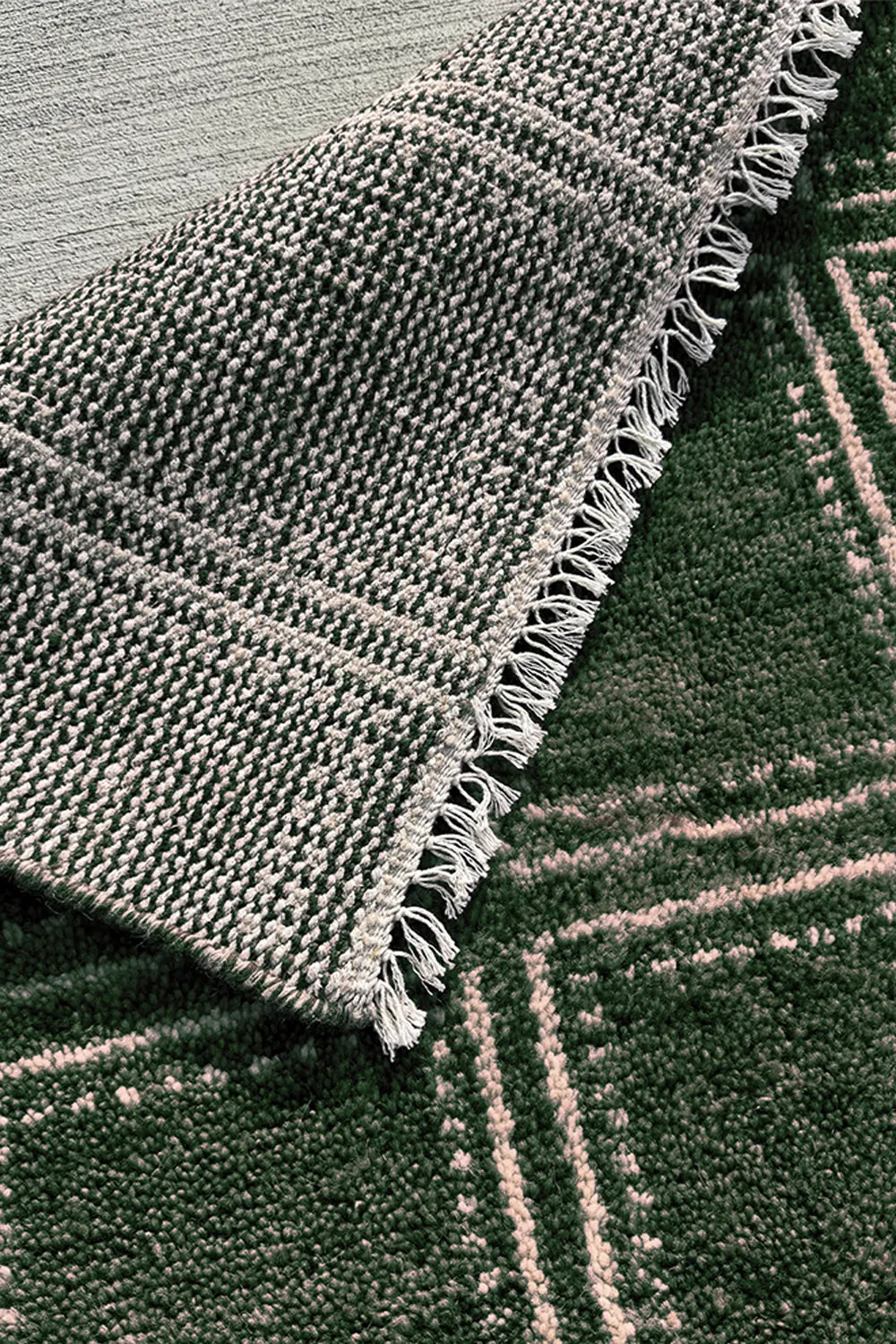 Green handmade wool rug with structured box design, perfect for modern interiors