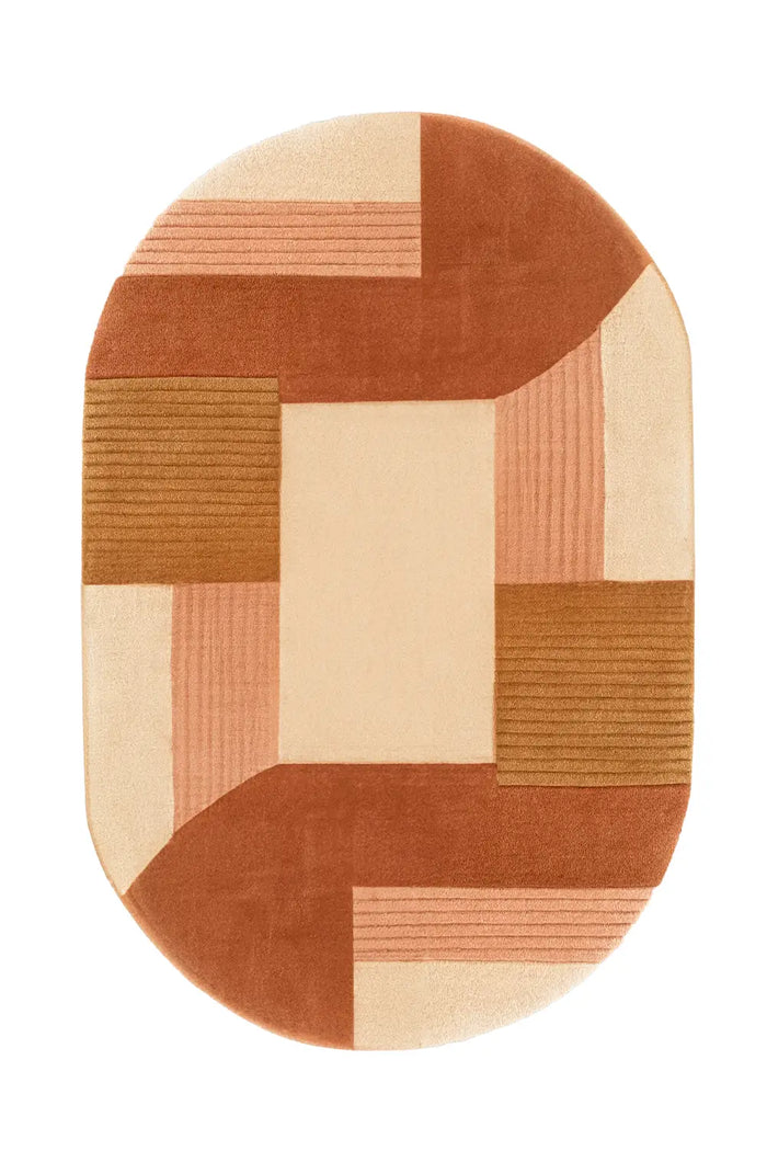 Rust and tan oval wool rug with color block pattern and minimalist modern style
