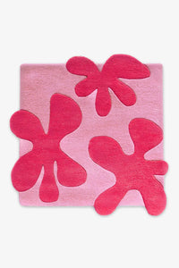 pink square floral area rug with hand-tufted botanical details