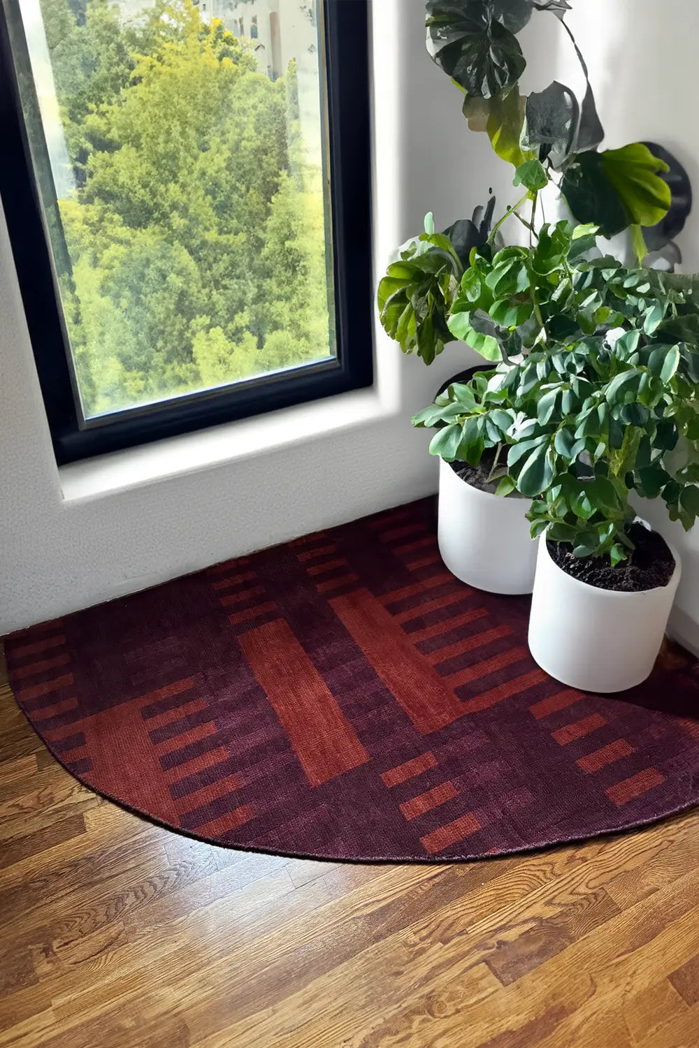 Hand-Knotted Red and Burnt Orange Oushak Corner Rug in a modern sunny room with plants lifestyle