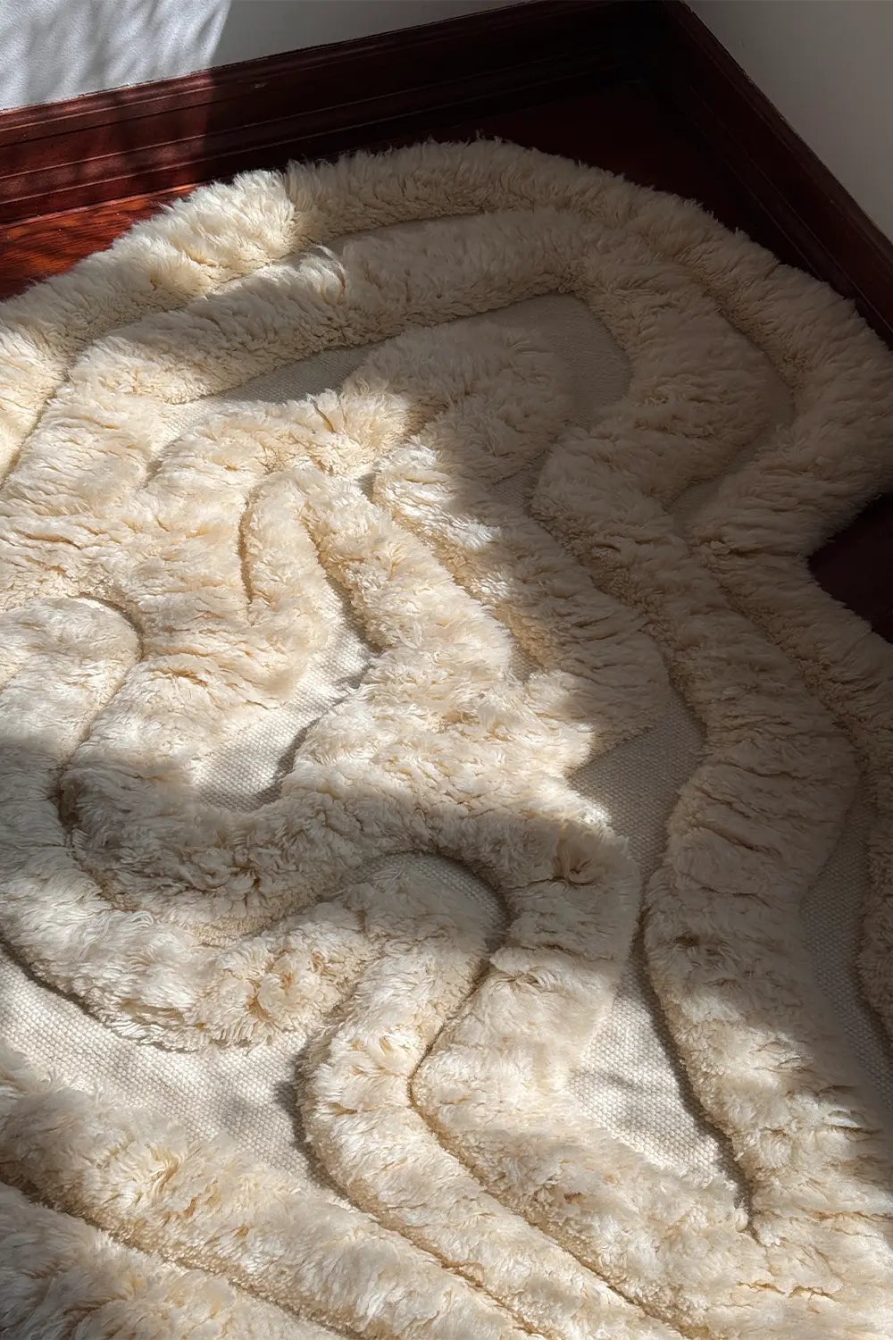 Rolling Tides Cream Shag Rug - Fluffy handwoven wool rug in organic shape

