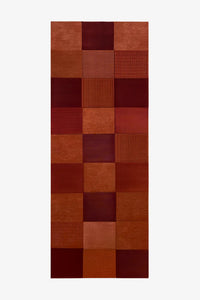 3x8 hallway runner rug with a modern geometric block pattern in burnt orange, burgundy and terracotta wool