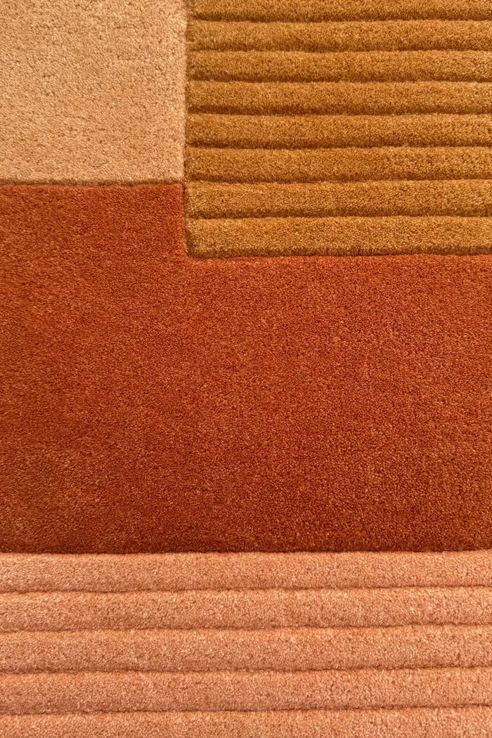 Hand-tufted wool rug in soft neutral earth tones with ridge details