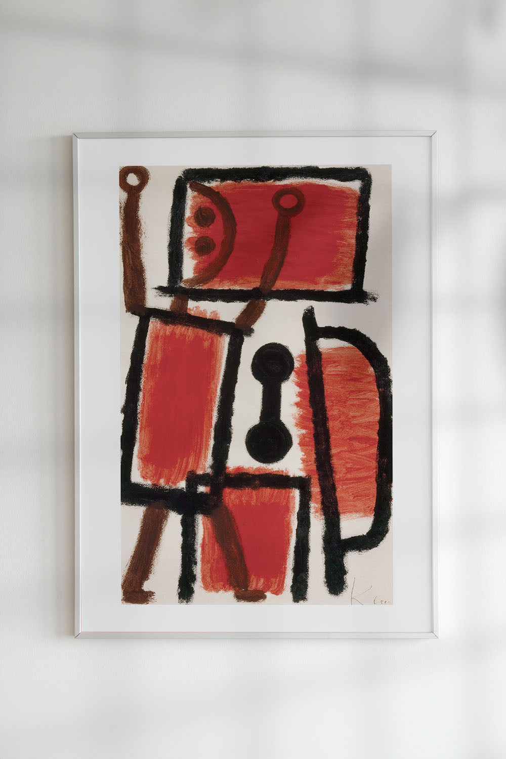 Art print of "Locksmith (1940)" by Paul Klee depicting a humorous red square figure with a black outline and smiley face.