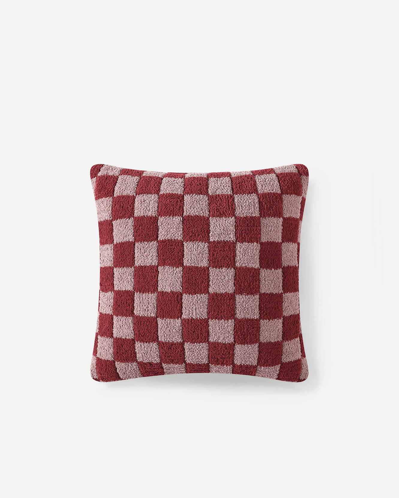 Vibrant red checkered pillow, adding a pop of color to bedroom decor.