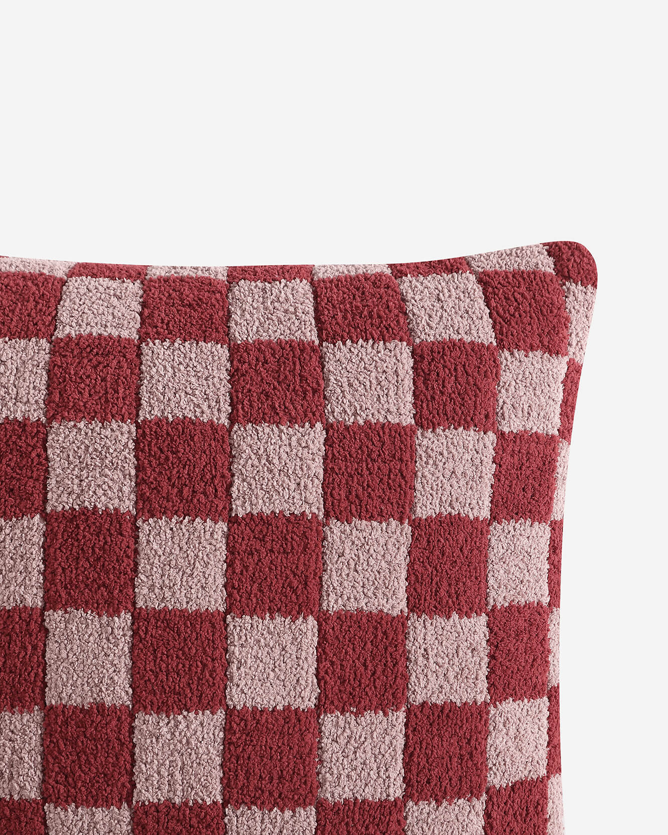 Close-up of the checkered pattern on the soft microfiber pillow cover.