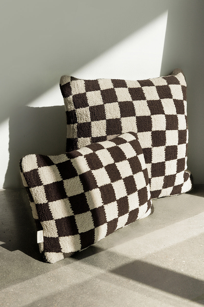 Square, large throw pillow with plush checkerboard pattern