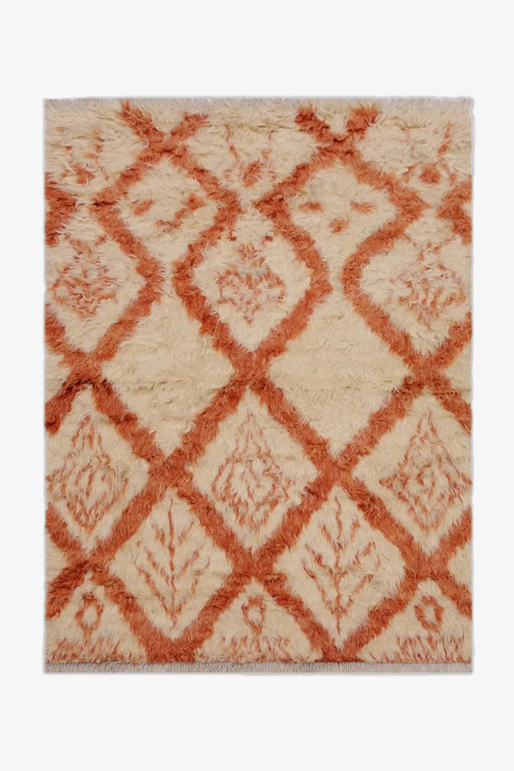 Cream and burnt orange wool shag rug in 8x10 size with diamond motif, perfect for adding texture to boho, eclectic, or modern living spaces