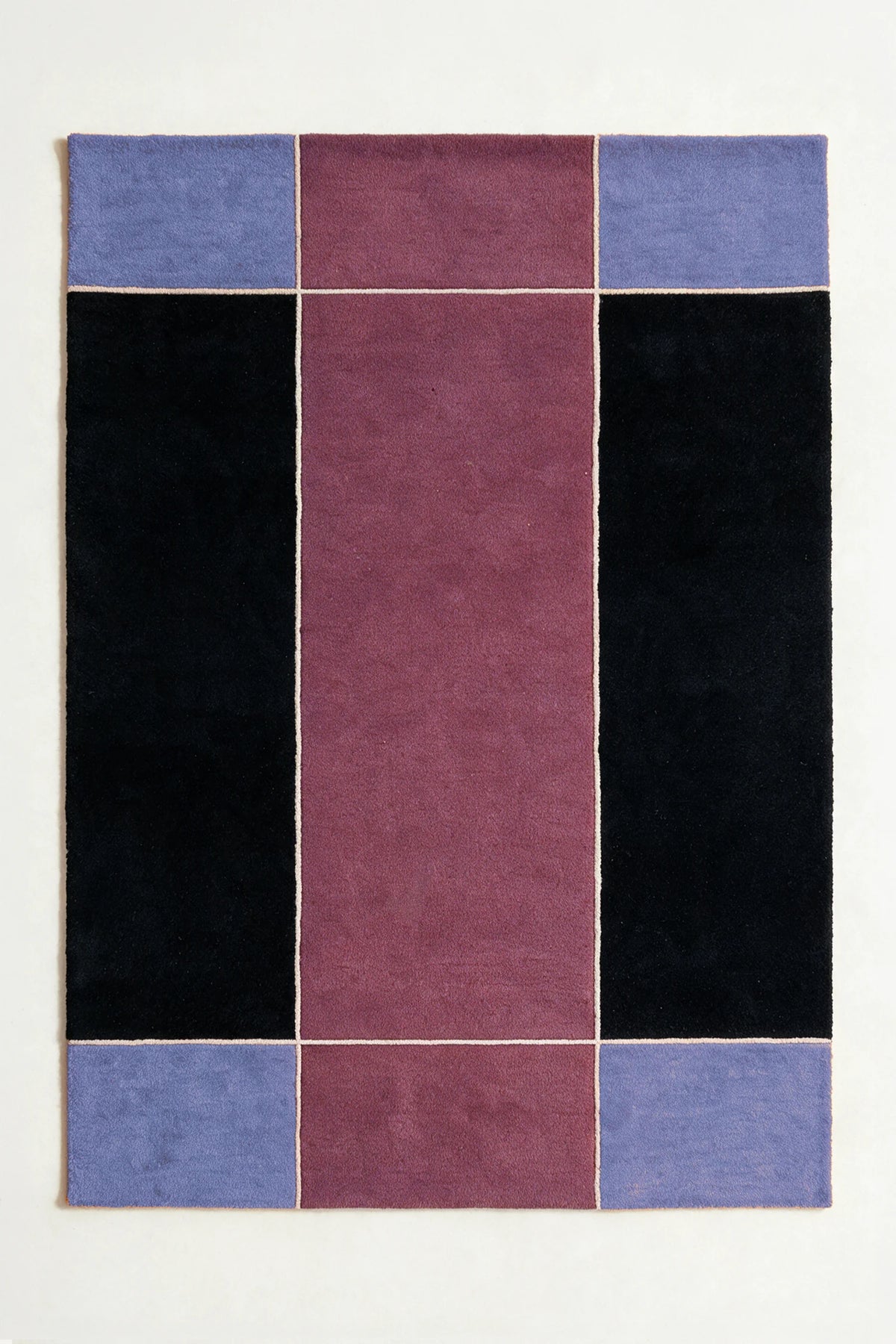 a axis hand-tufted wool rug in black, periwinkle, mauve and oat, shown flat from above