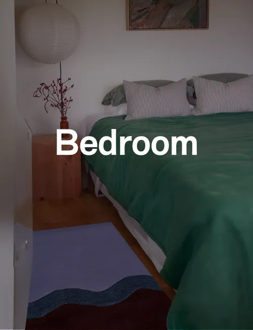 Bedroom with a purple and brown wool runner rug