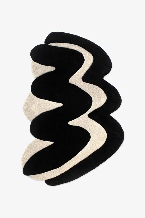 Black and white abstract rug on a white background