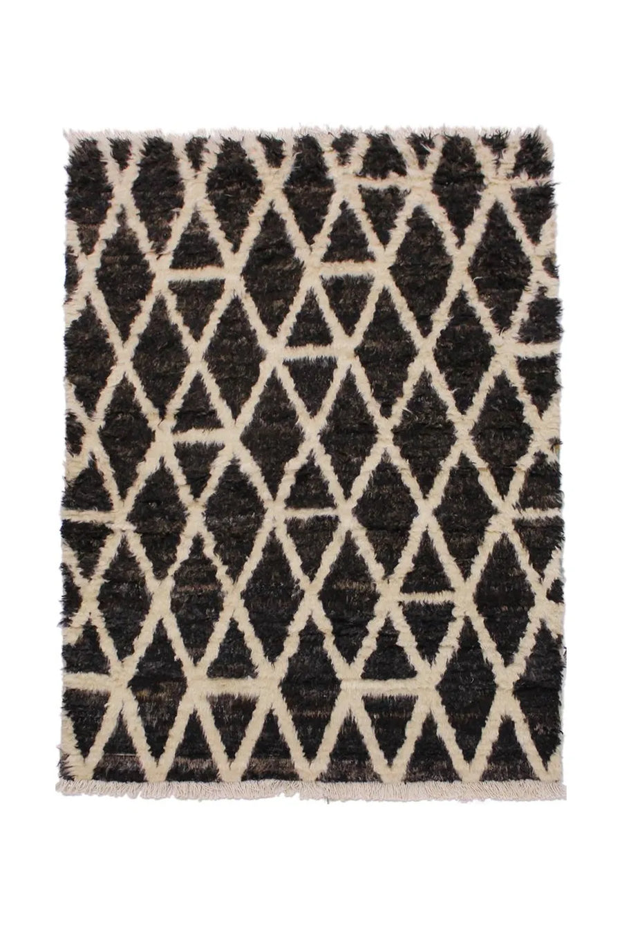 Plush Moroccan shag rug in black and white with a modern geometric pattern.