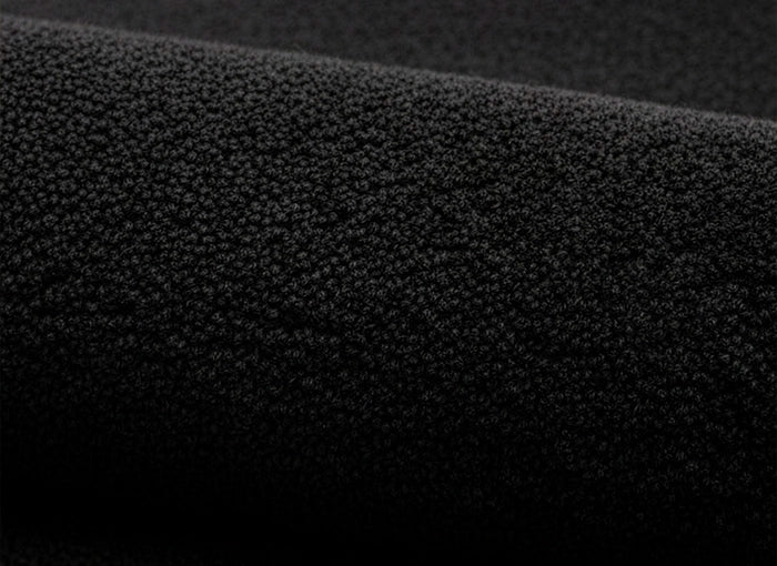 Close-up of black tufted rug