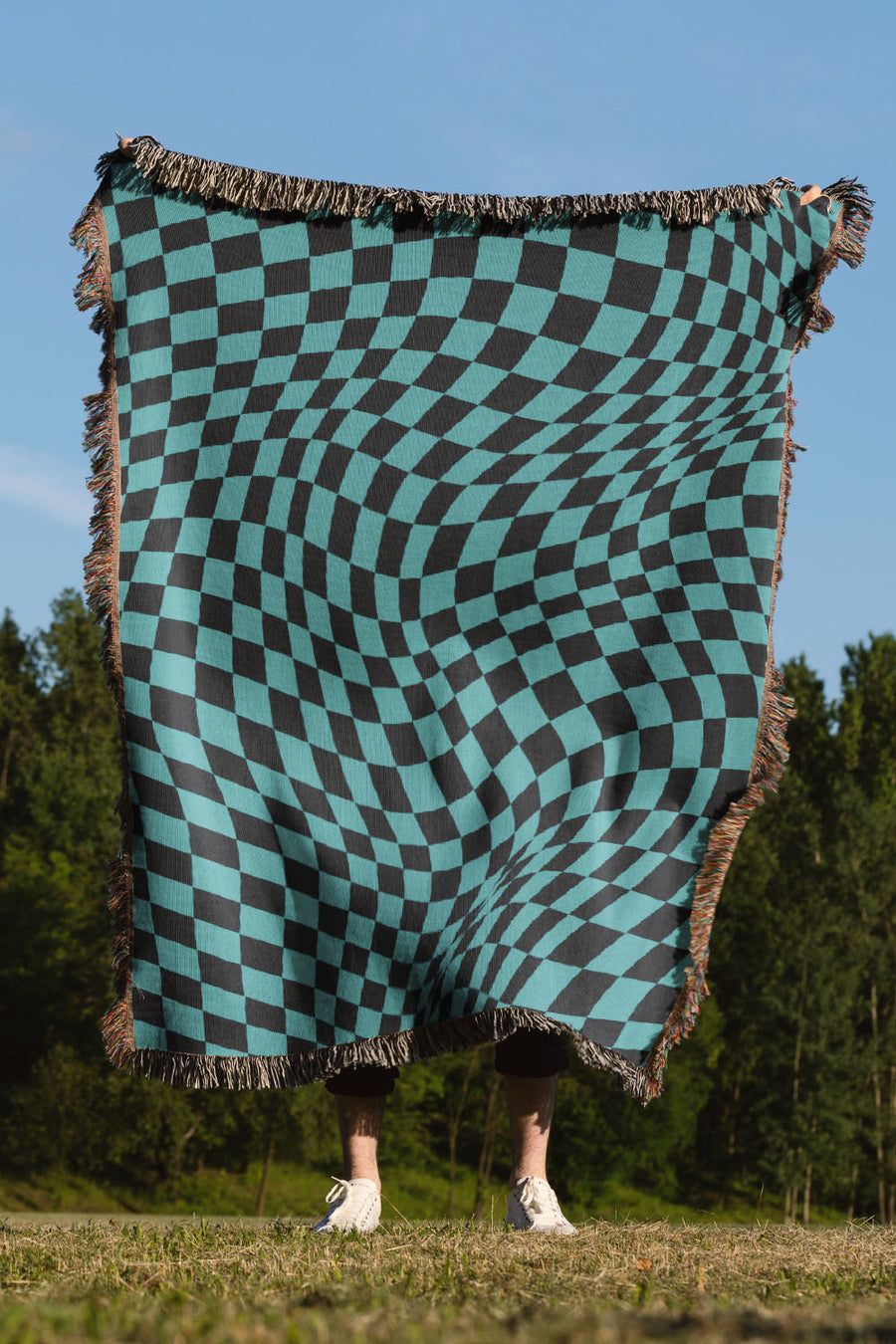 Trippy Checkers Black and Blue Cotton Woven Throw Blanket with a psychedelic checker pattern and fringe edges.