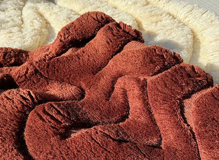 close up of neutral shag rugs with organic shape design