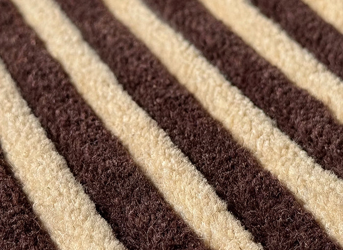 Close-up of brown and beige striped rug
