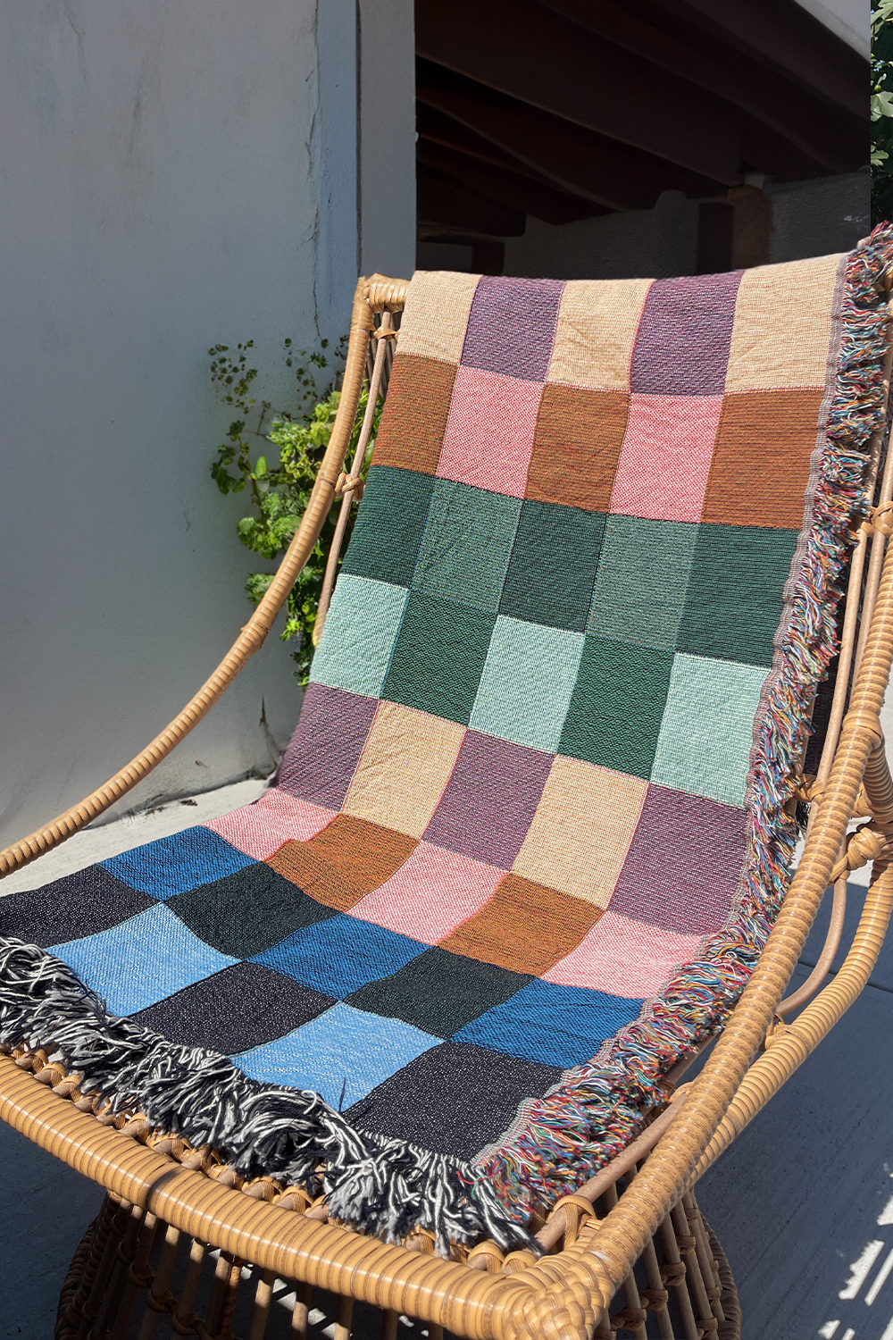 Vibrant Gingham Cotton Woven Throw Blanket with a colorful checker pattern.