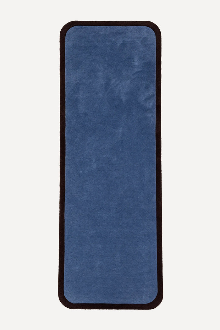 a contour edge hand-tufted wool runner in slate and espresso, shown flat from above