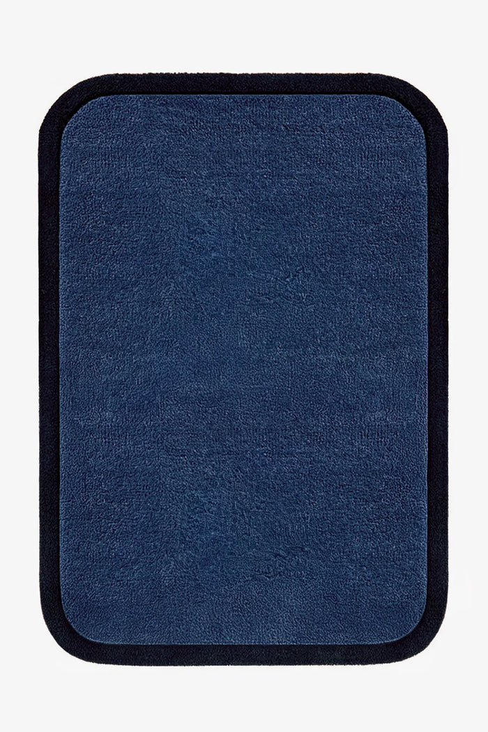 9x12 navy blue wool rug with rich dark border and dense modern weave