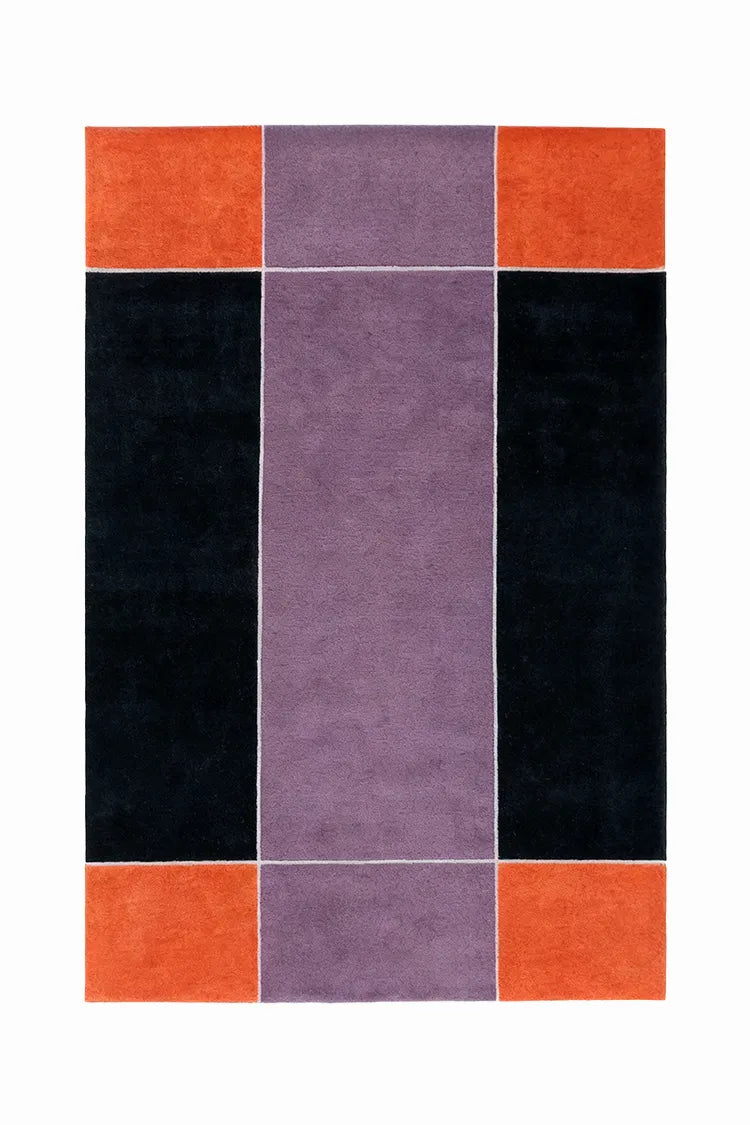 Rectangular rug with a geometric pattern of orange, purple, and black squares on a white background