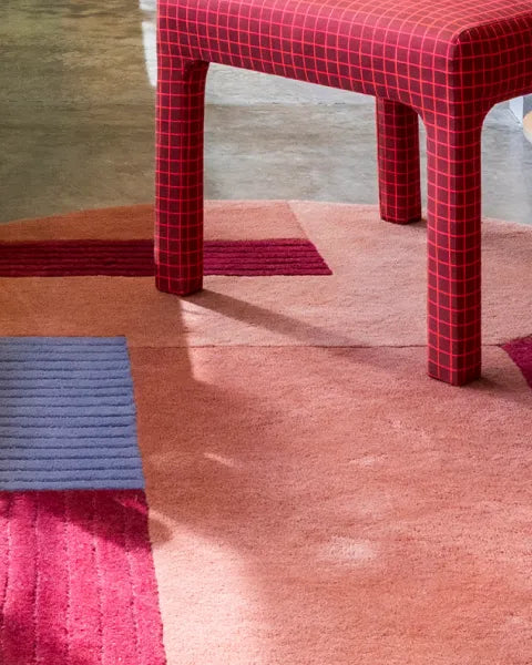 Red checkered chair on a multicolored rug