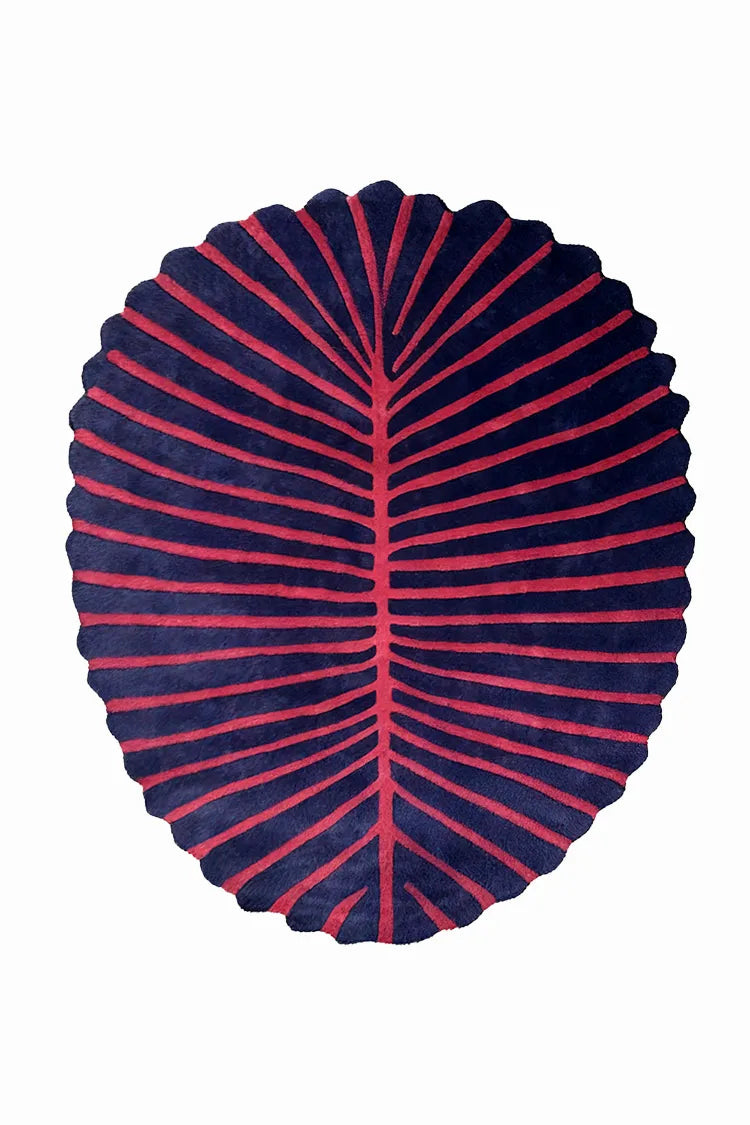 custom rug with leaf shape in red and navy striped pattern on a white background