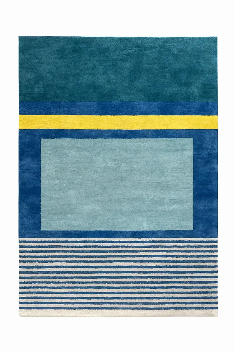 custom wool rug with blue and yellow geometric design on a white background