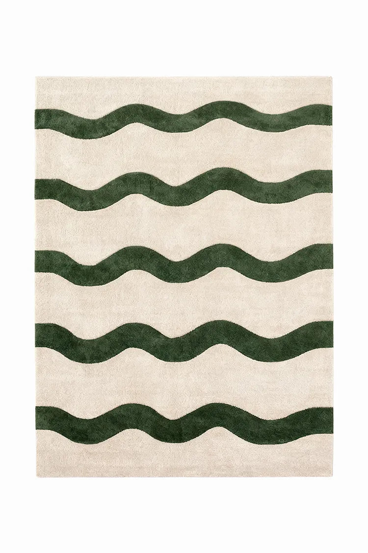 custom wool rug with green wavy pattern on beige background
