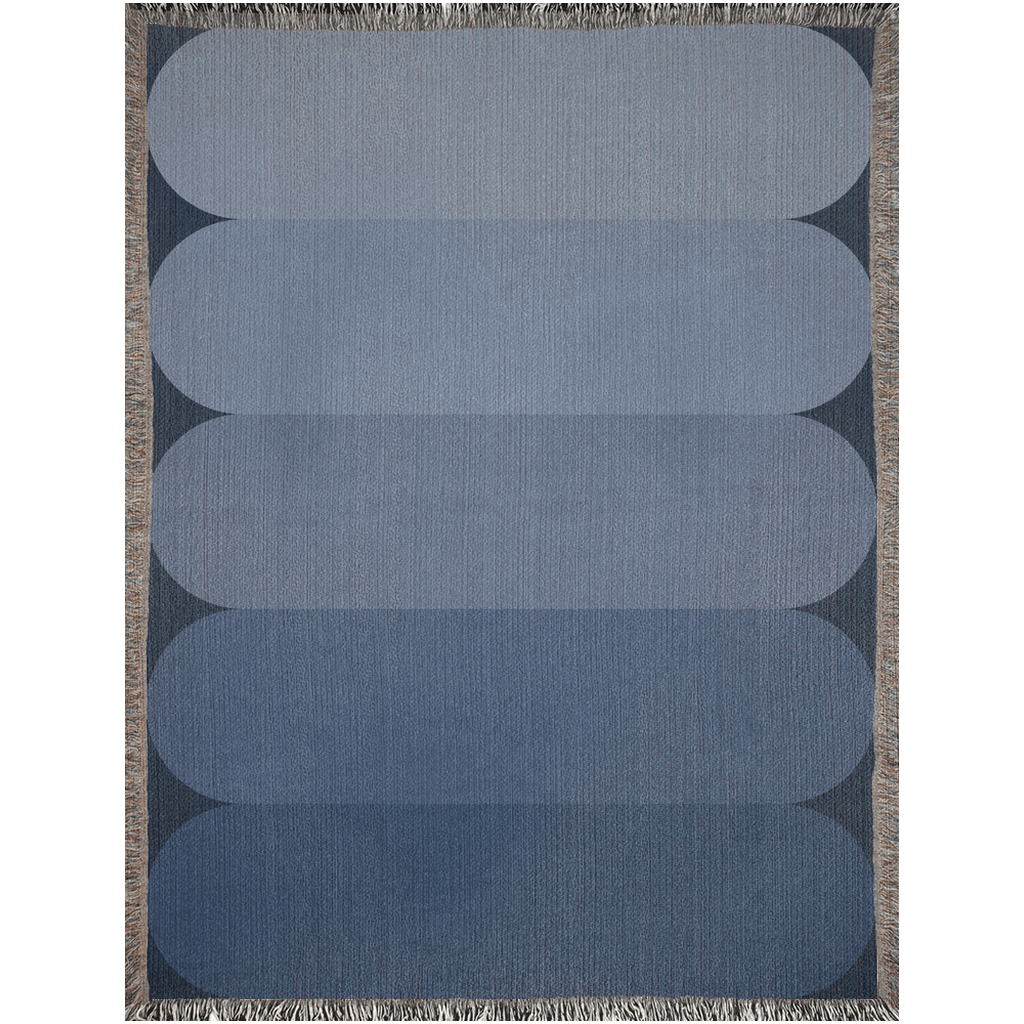 Minimalist cotton throw blanket with a soft blue color gradient.
