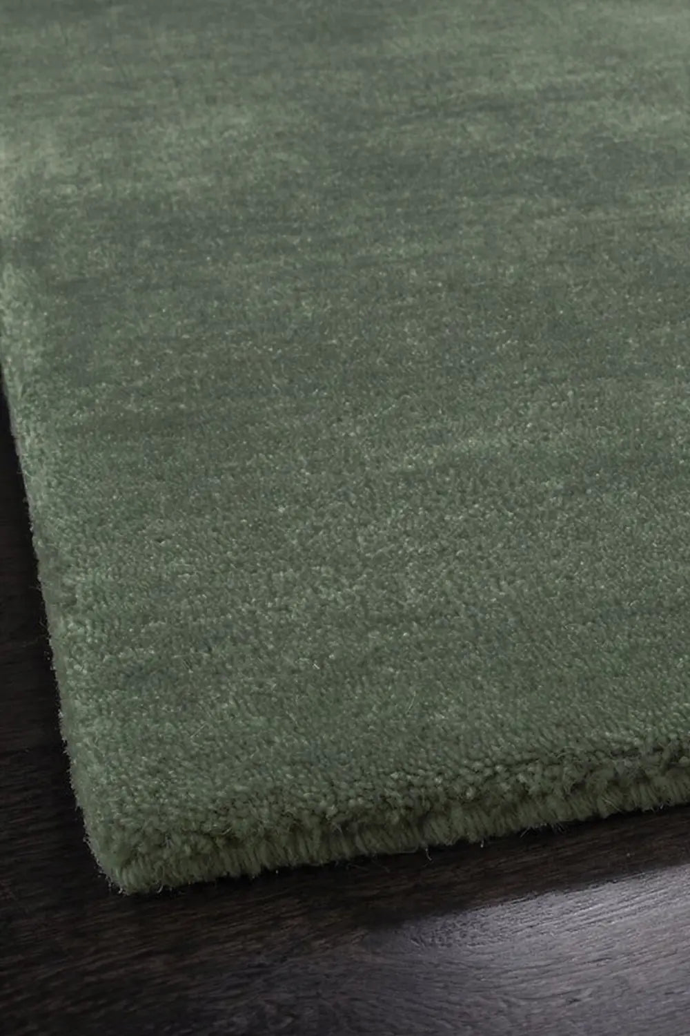 green wool hand tufted rug