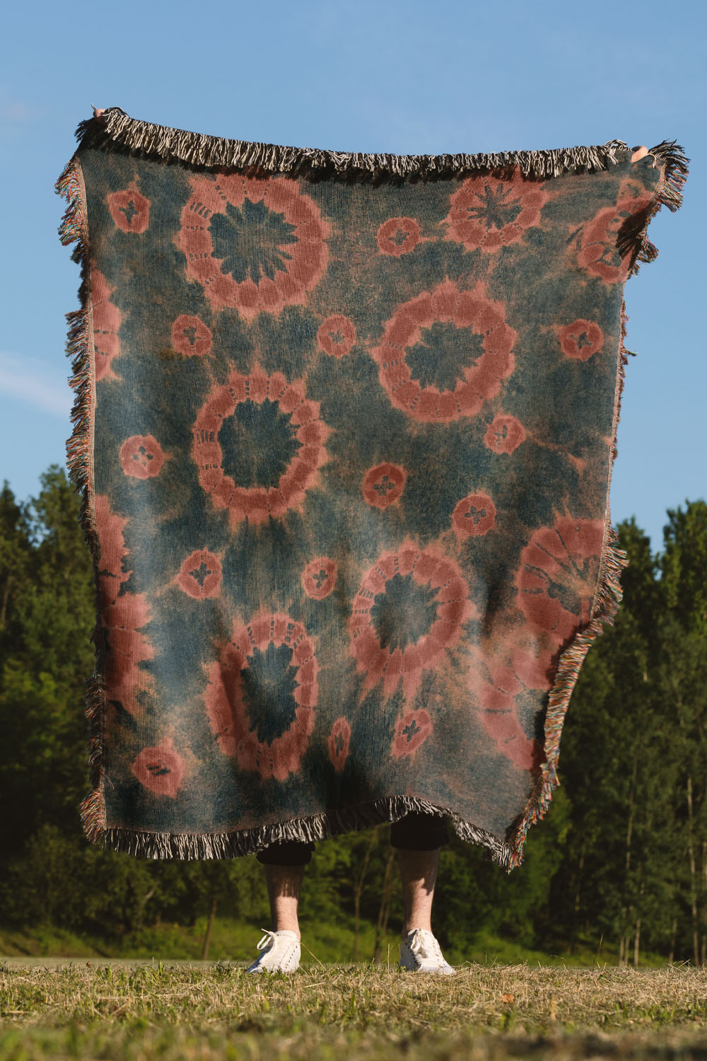 Navy and Rust Tie Dye Cotton Woven Throw Blanket showcasing a boho-inspired tie-dye design in navy and rust.