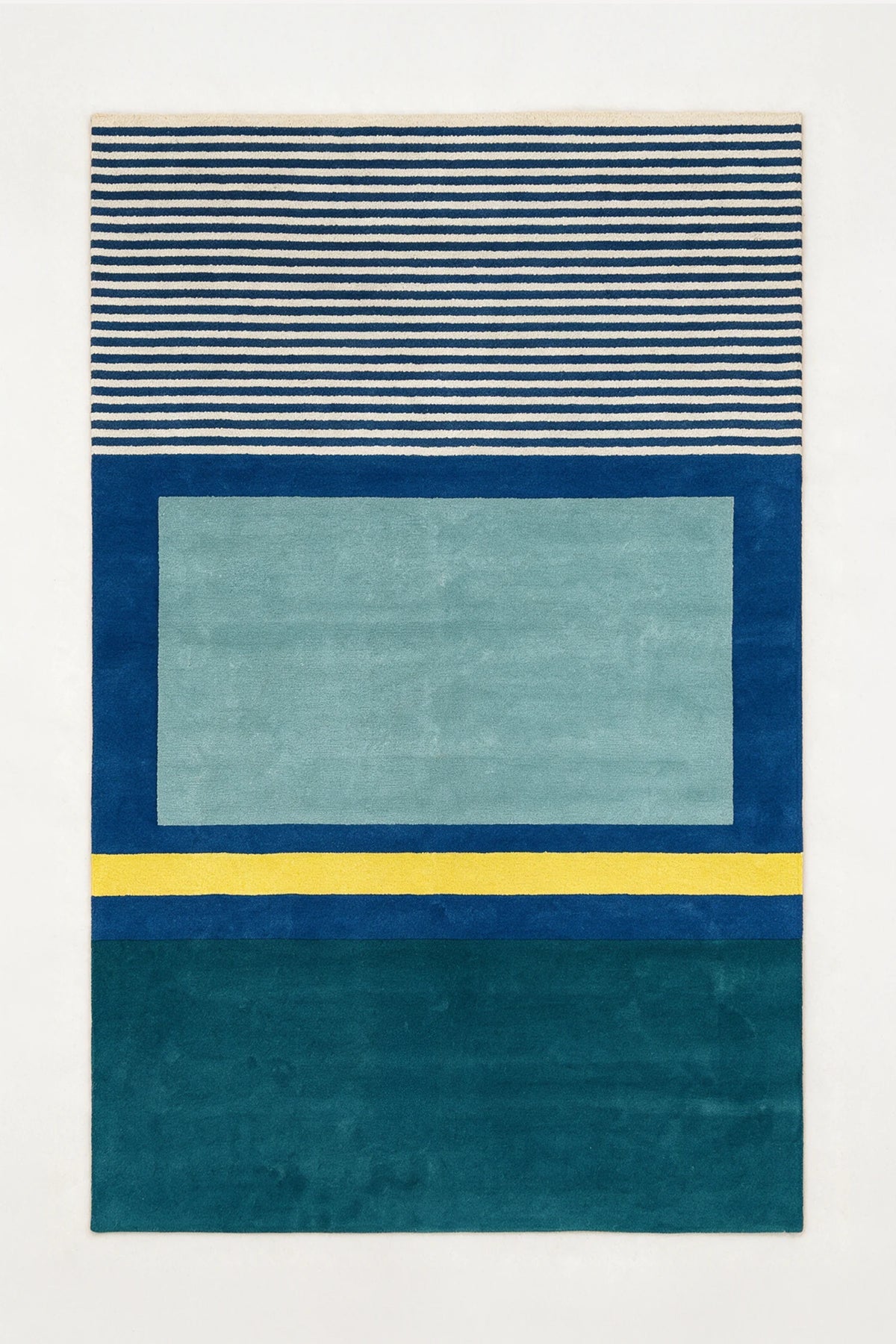 a fieldwork hand-tufted wool rug in ocean, teal, oat and mustard, shown flat from above
