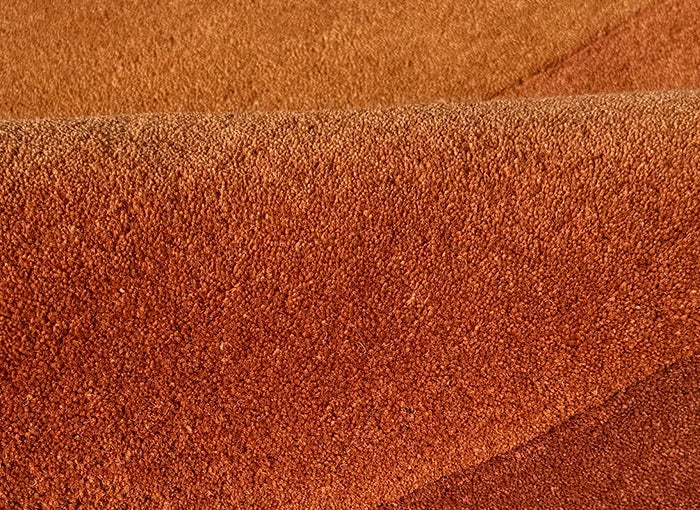Close-up of a gold and orange rug