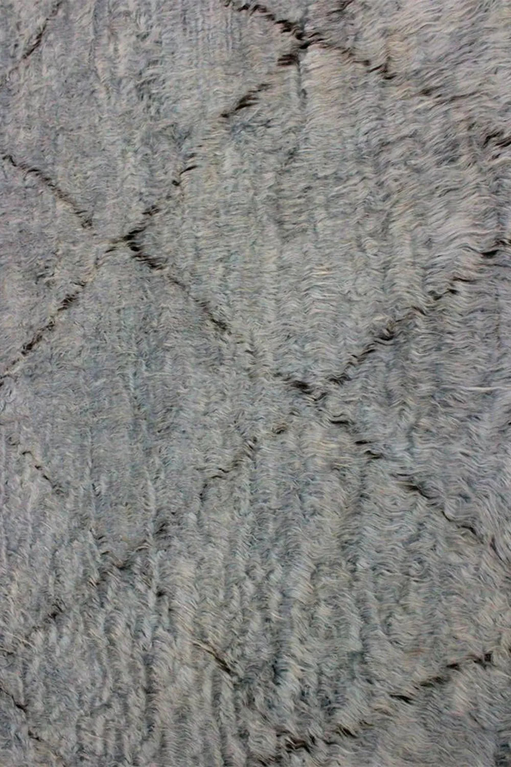 Simple yet elegant gray shag rug with a diamond pattern for a chic look.