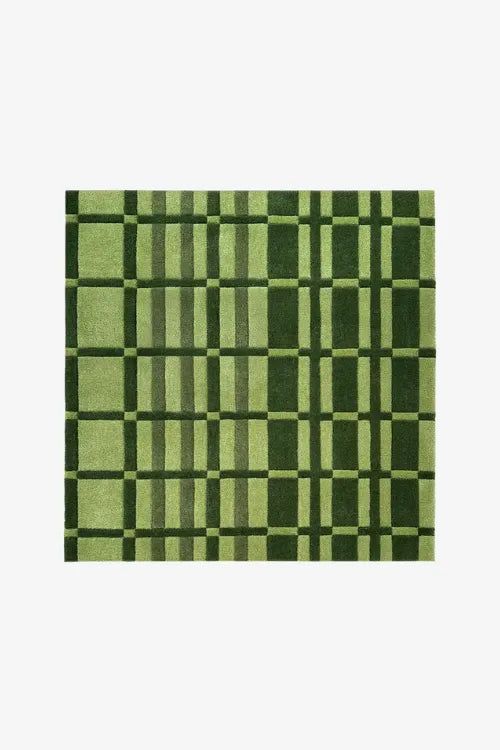 green square rug with geometric striped pattern