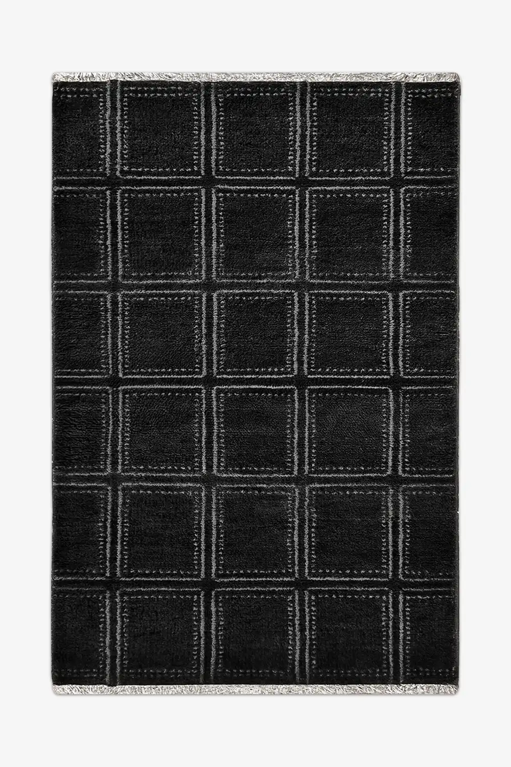 Black checkered wool rug with white lines on a white background