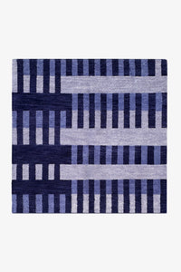 blue striped square rug made from hand-knotted wool