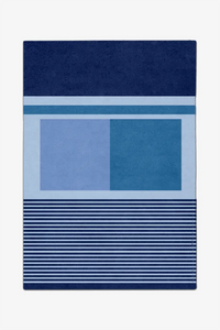 8x10 blue custom rug with geometric patterns on a white background