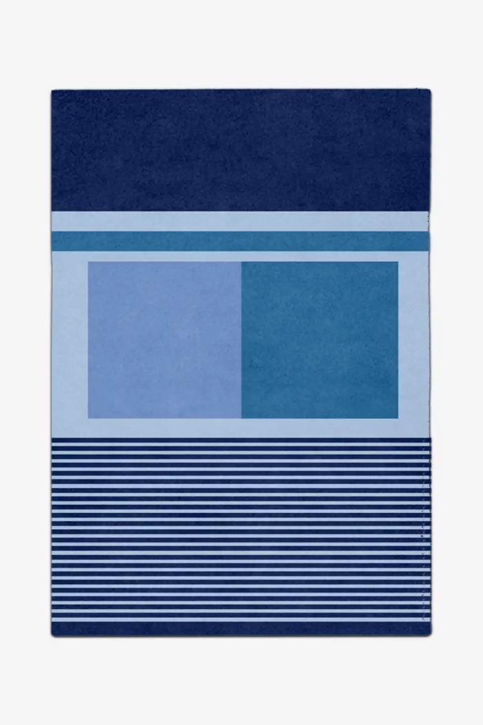 8x10 blue custom rug with geometric patterns on a white background