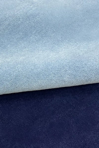 light blue and navy tufted wool rug with soft durable plush texture indigo