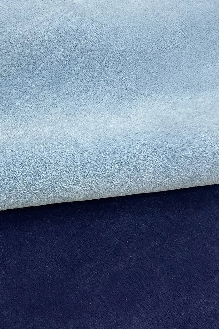 light blue and navy tufted wool rug with soft durable plush texture indigo