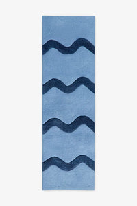 Light blue runner rug with navy blue wavy stripes, modern wool runner for living room or hallway