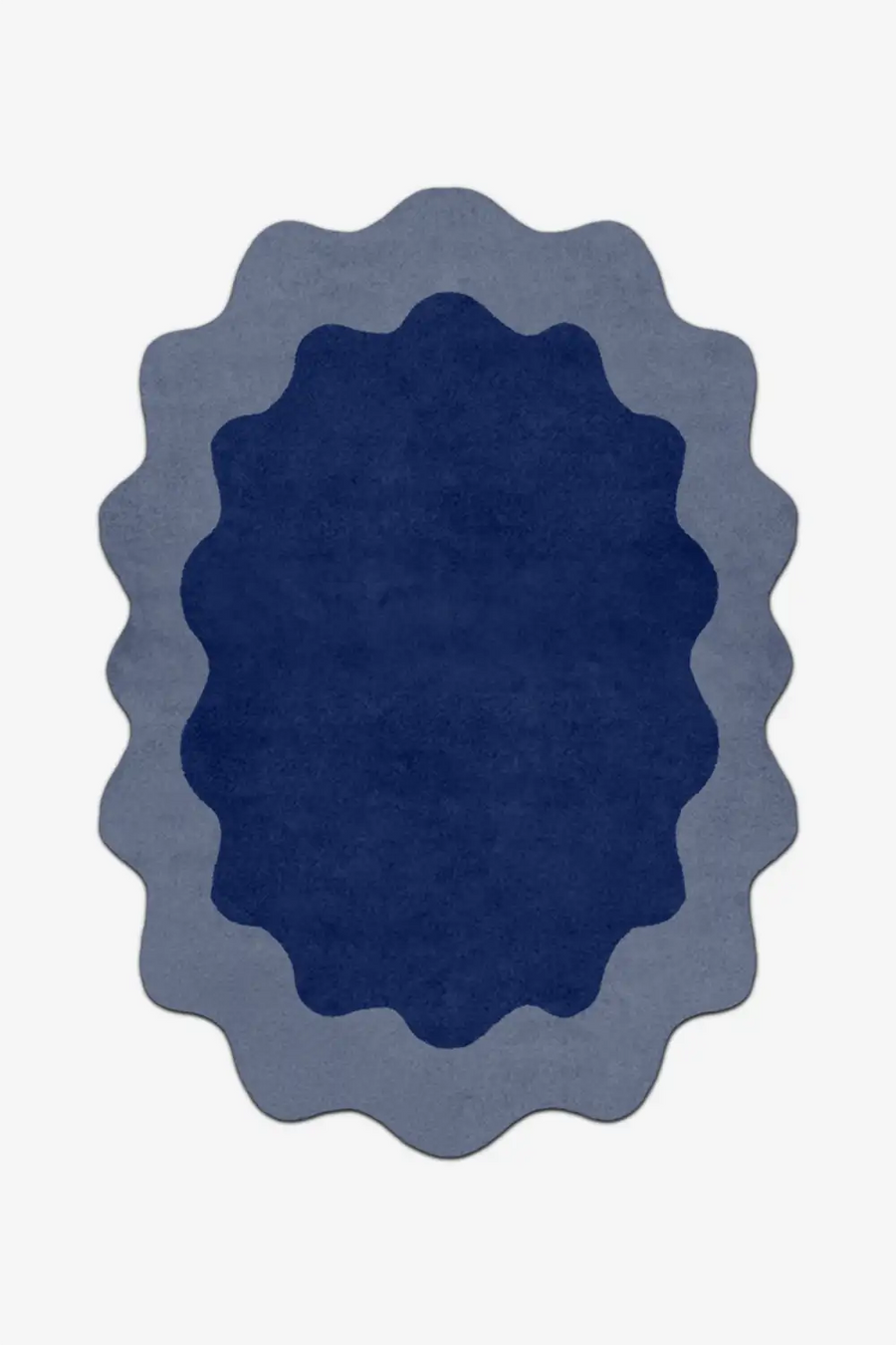 Blue oval rug with scalloped edge on a white background