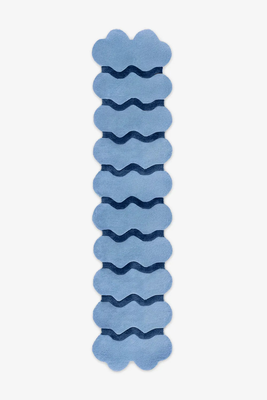 Extra long sculptural blue wool runner with navy waves, ideal for colorful hallway styling