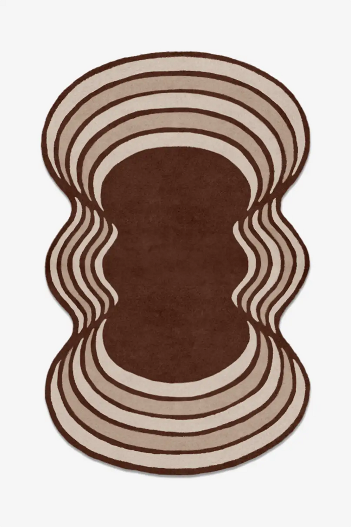 Rug with wavy brown and beige pattern on a white background