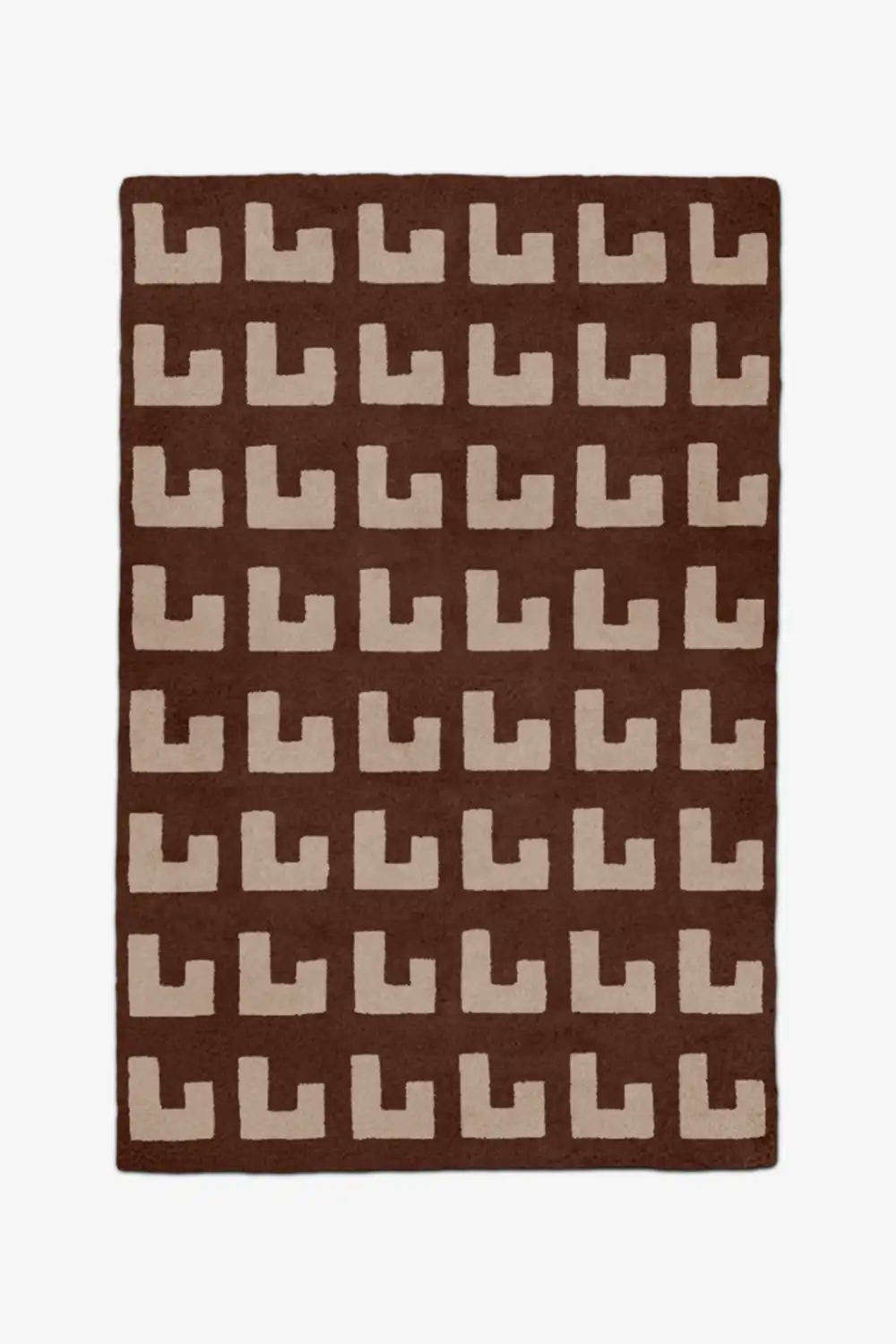 Brown rug with beige geometric patterned wool rug on a white background