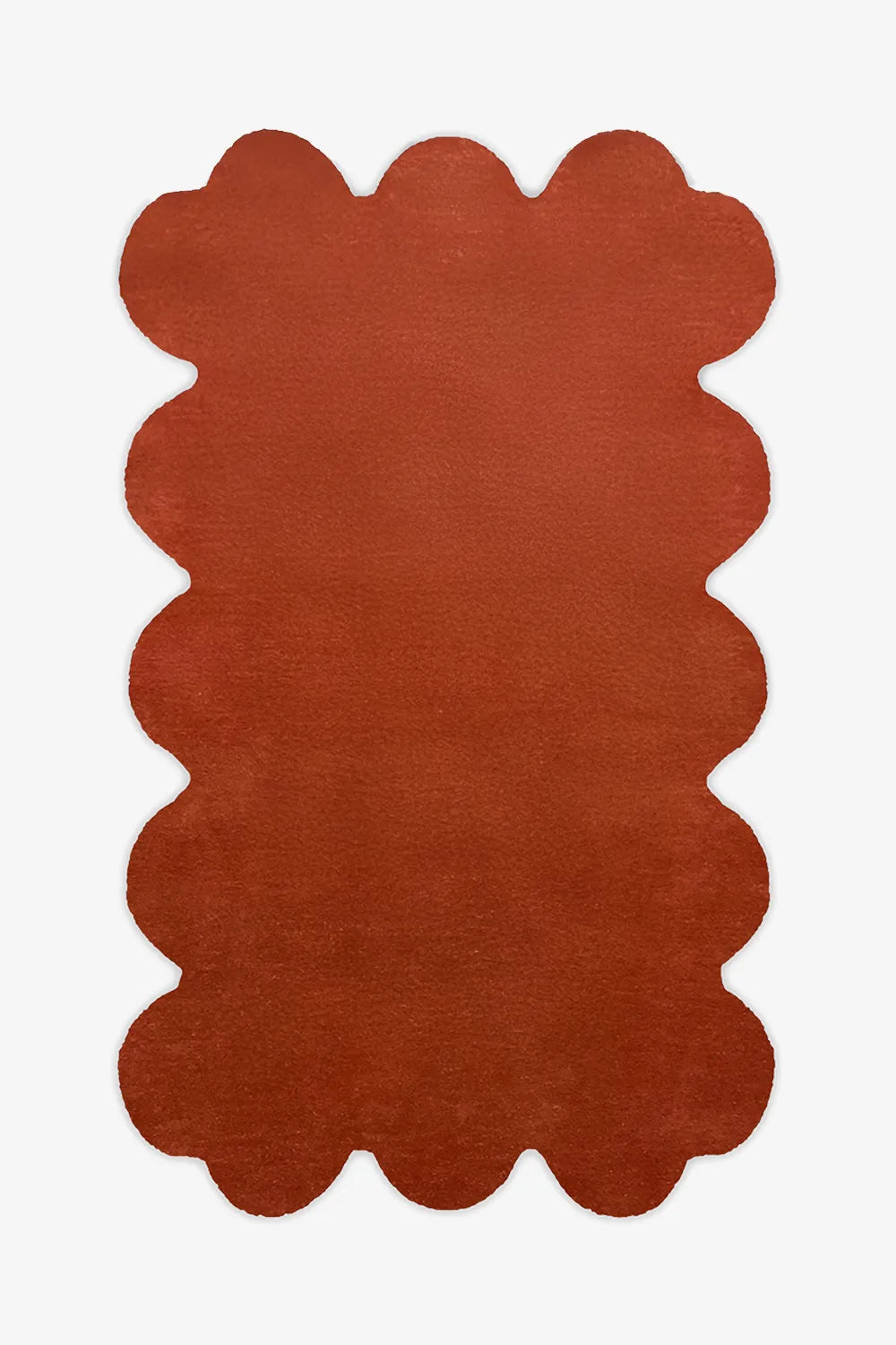 8x10 burnt orange scalloped wool rug with hand-tufted plush pile and sculptural edge design, ideal for modern living rooms